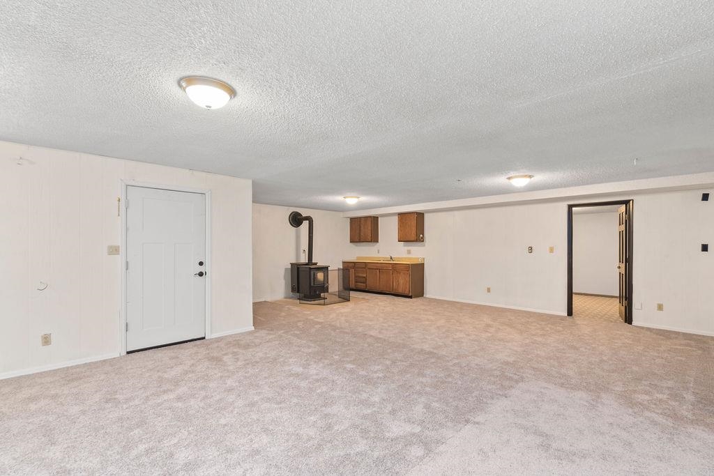 2590 I Road Grand Junction, CO 81505 - Photo 20 of 41 an empty room with kitchen and a sink