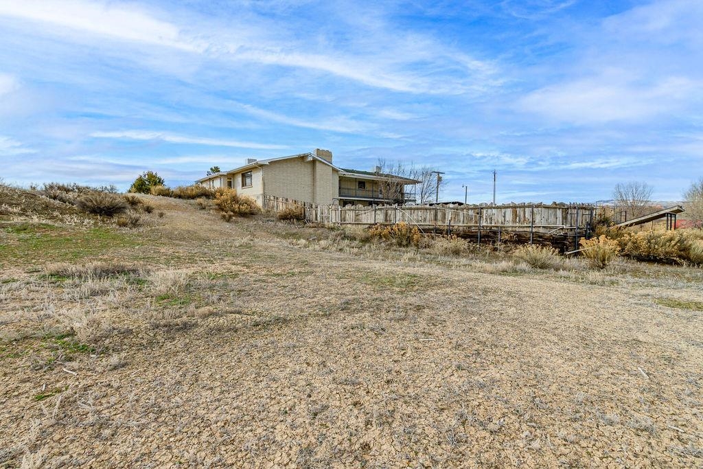 2590 I Road Grand Junction, CO 81505 - Photo 32 of 41 a view of a dry yard with wooden fence
