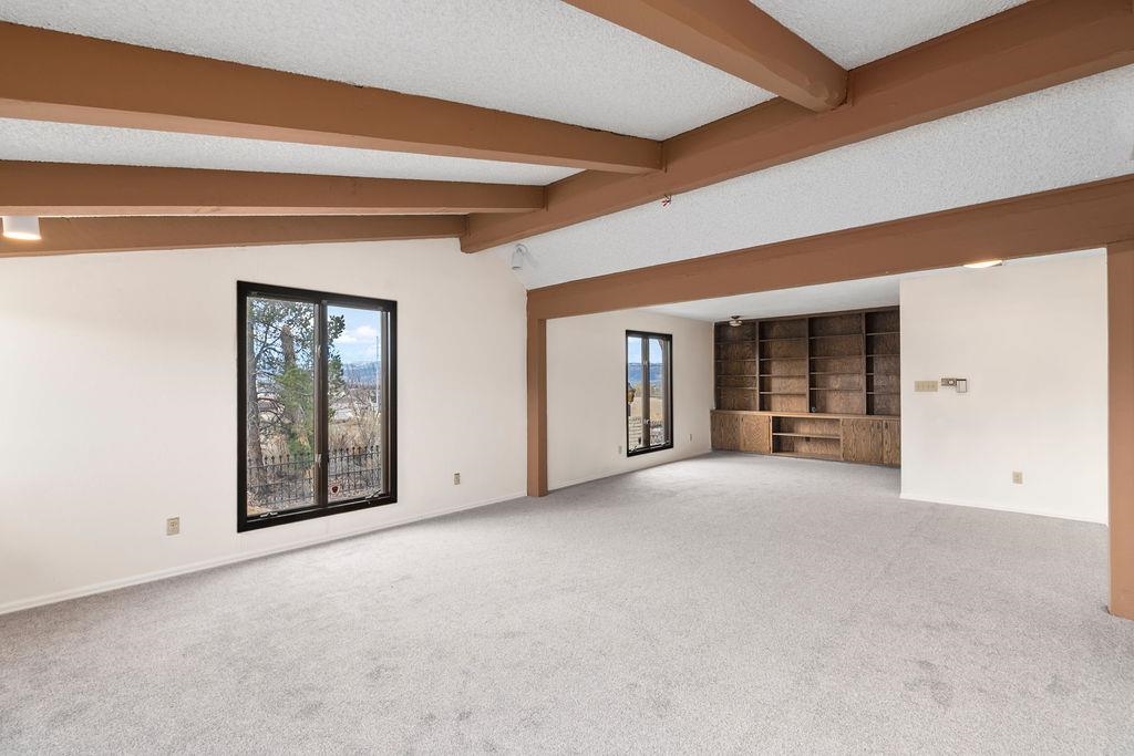 2590 I Road Grand Junction, CO 81505 - Photo 5 of 41 a view of an empty room with window and fireplace
