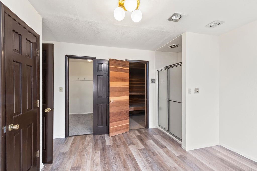2590 I Road Grand Junction, CO 81505 - Photo 7 of 41 a view of an empty room with wooden floor and a window