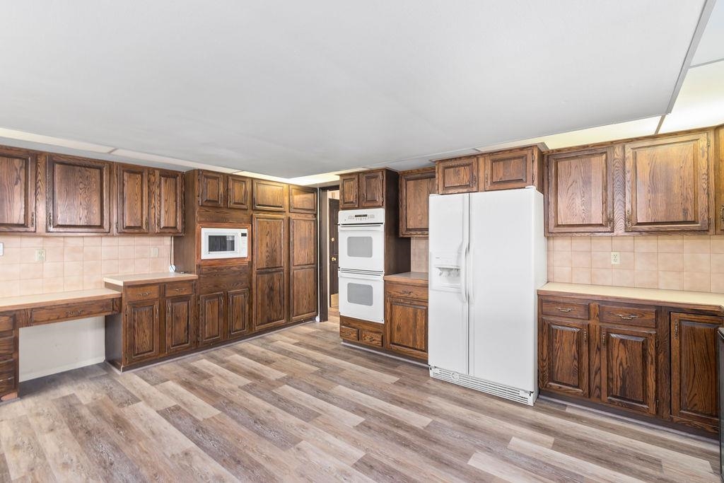 2590 I Road Grand Junction, CO 81505 - Photo 10 of 41 a kitchen with a refrigerator sink and cabinets