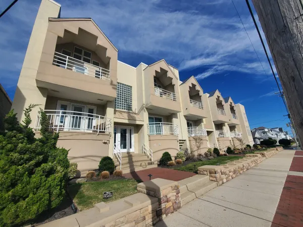 a view of a building with a yard