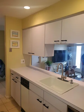 a kitchen with a sink and cabinets
