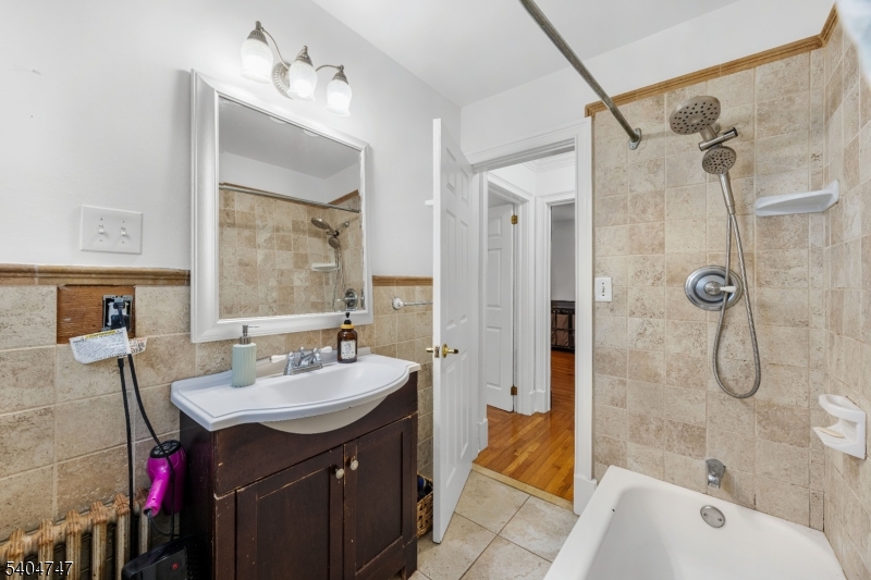 45 Dreahook Road Somerville, NJ 08876 - Photo 12 of 26 a bathroom with a sink double vanity mirror and a bath tub