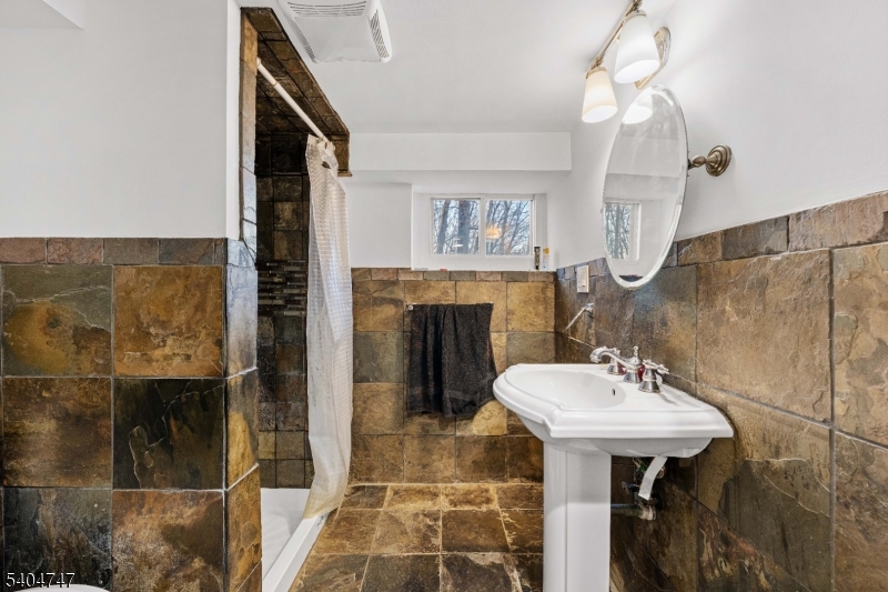 45 Dreahook Road Somerville, NJ 08876 - Photo 13 of 26 a bathroom with a sink and a mirror