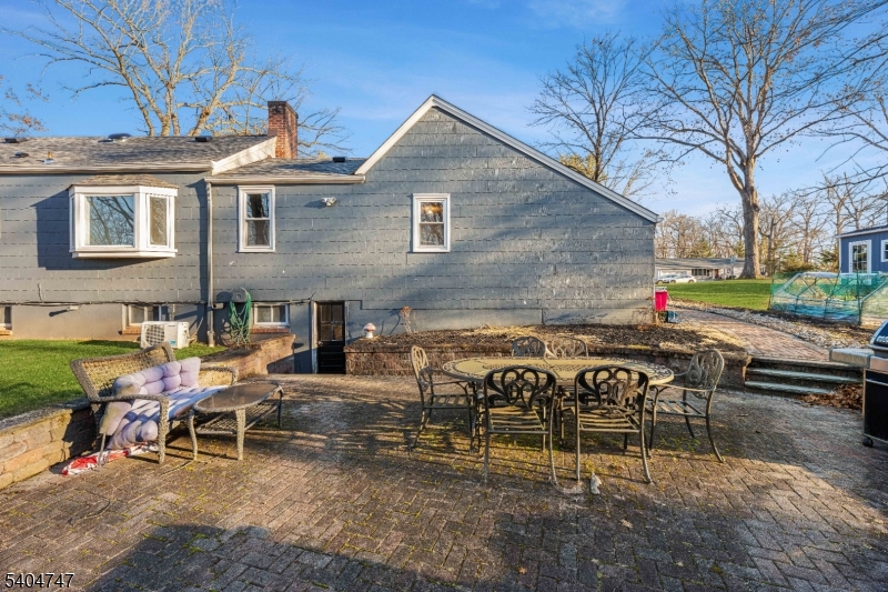 45 Dreahook Road Somerville, NJ 08876 - Photo 15 of 26 a view of a chairs and table in backyard of the house