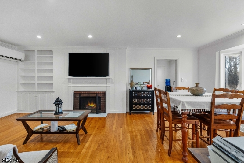 45 Dreahook Road Somerville, NJ 08876 - Photo 5 of 26 a living room with furniture a fireplace and a flat screen tv