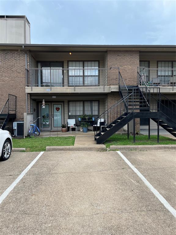 4460 Chaha Road, Unit 205 Garland, TX 75043 - Photo 23 of 27 a car parked in front of a white building