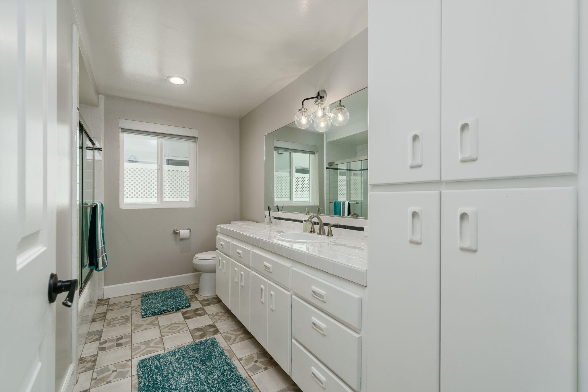 5235 Sealane Way Oxnard, CA 93035 - Photo 30 of 53 a bathroom with a sink mirror and vanity