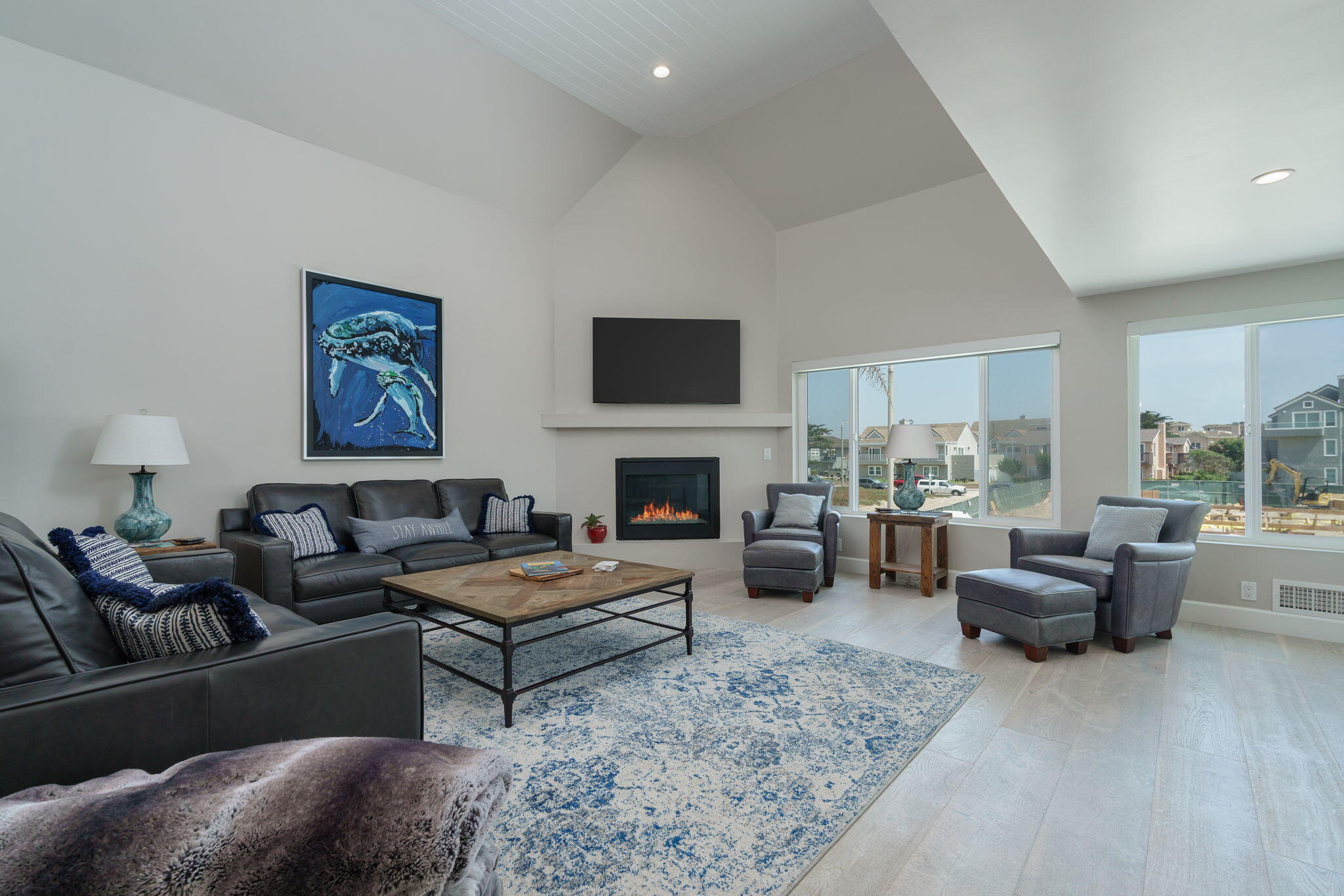 5235 Sealane Way Oxnard, CA 93035 - Photo 8 of 53 a living room with furniture fireplace and a flat screen tv