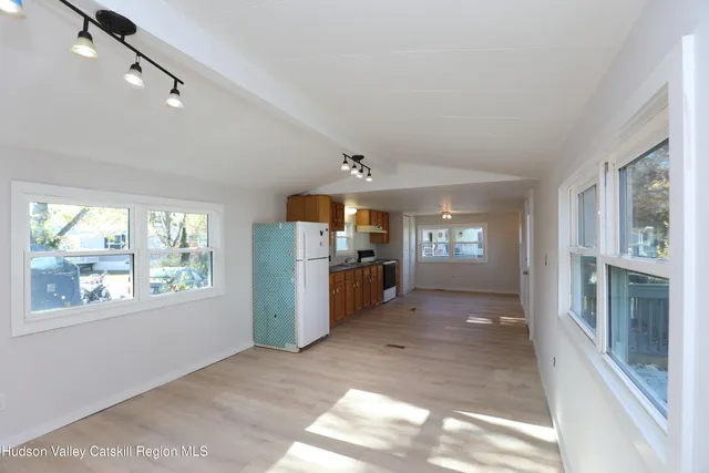a view of a hallway with windows