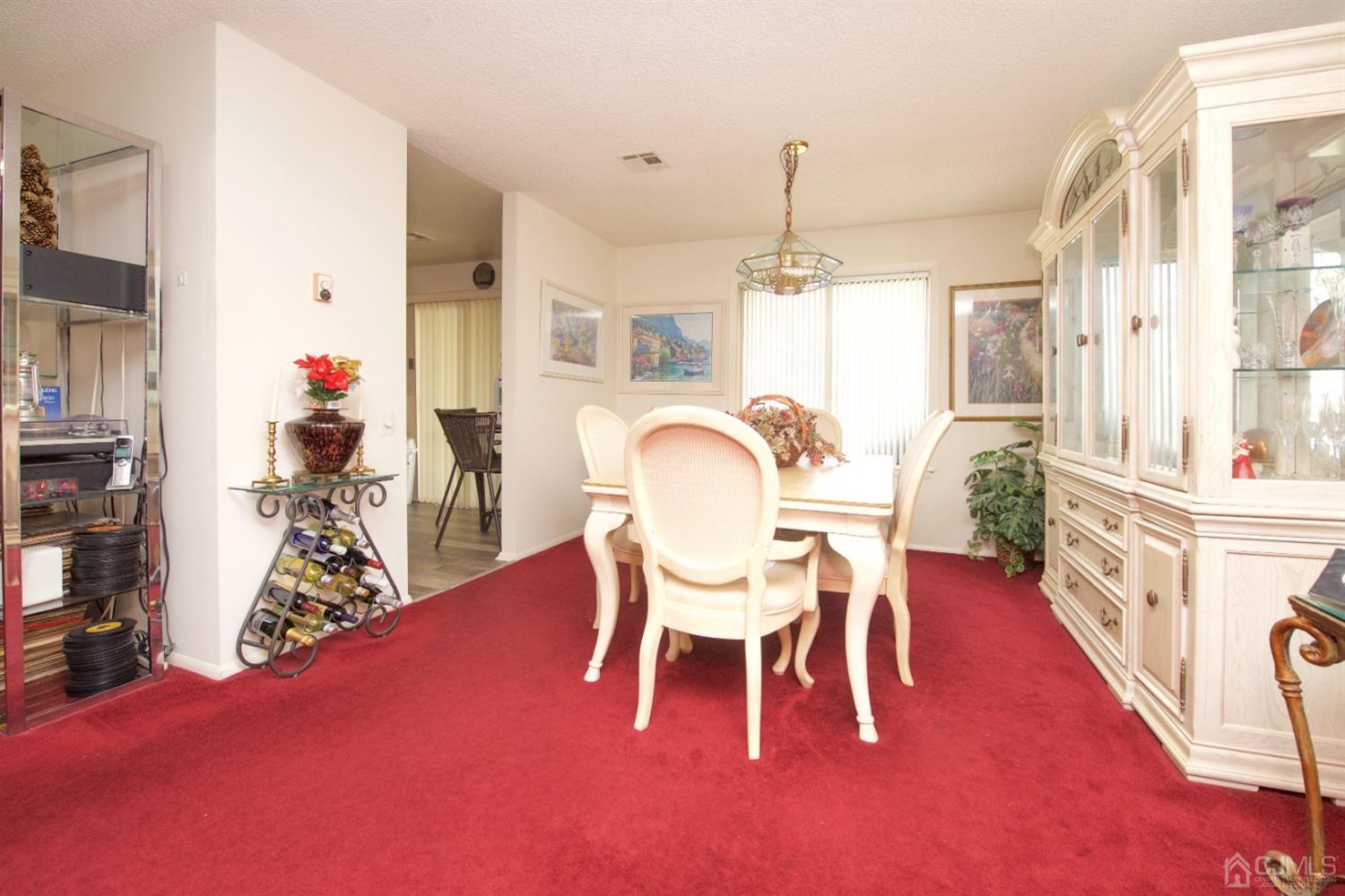 A Pompton Road Monroe Township, NJ 08831 - Photo 14 of 30 a view of a dining room with furniture window and wooden floor