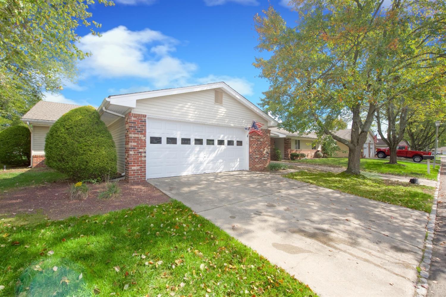 A Pompton Road Monroe Township, NJ 08831 - Photo 2 of 30 a front view of a house with a yard and garage