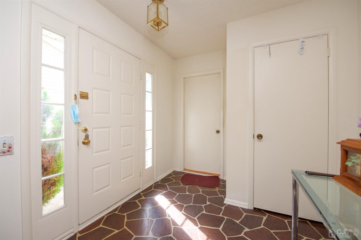 A Pompton Road Monroe Township, NJ 08831 - Photo 4 of 30 a bathroom with a glass door shower and a sink