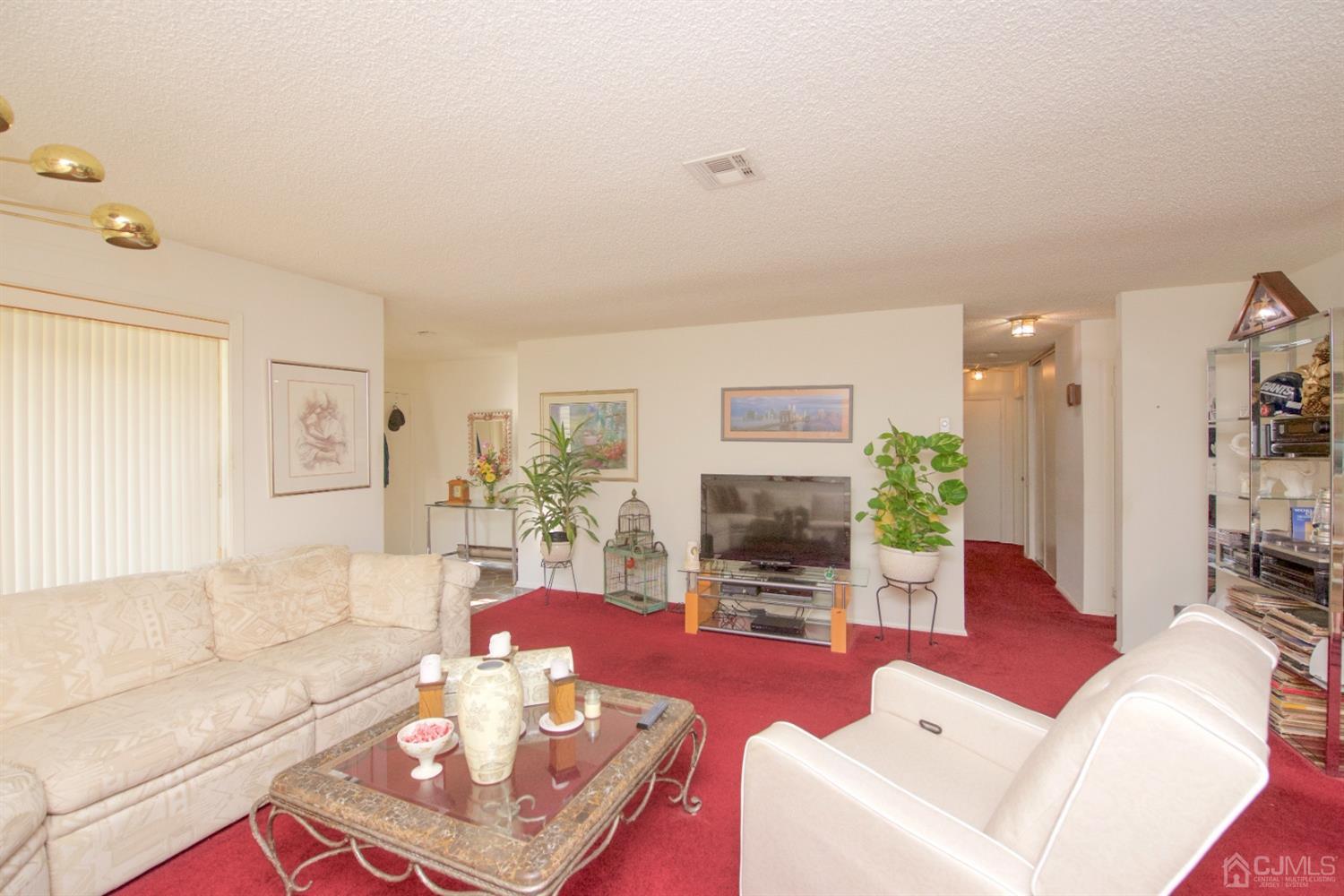A Pompton Road Monroe Township, NJ 08831 - Photo 5 of 30 a living room with furniture and wooden floor