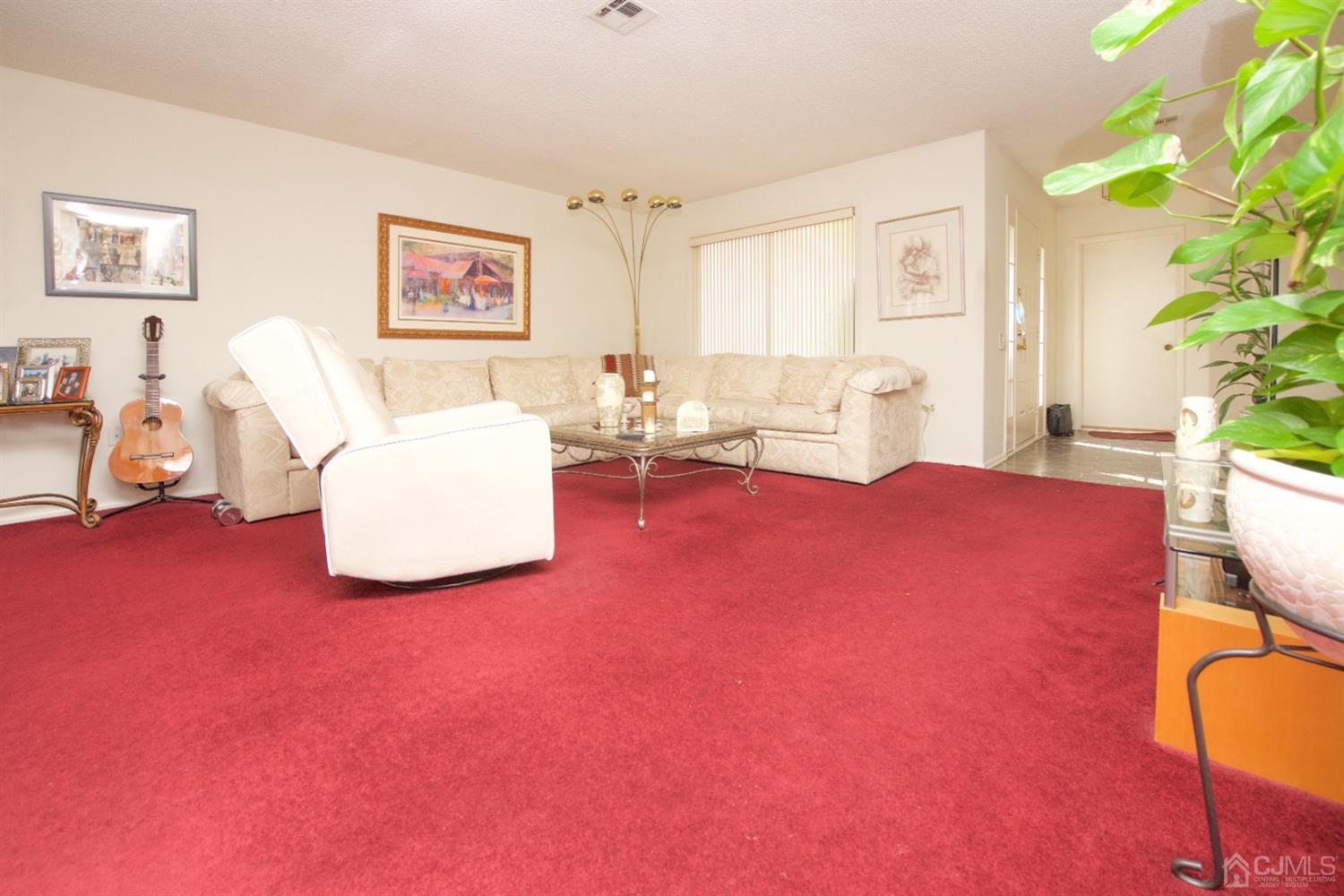 A Pompton Road Monroe Township, NJ 08831 - Photo 6 of 30 a living room with furniture and a window