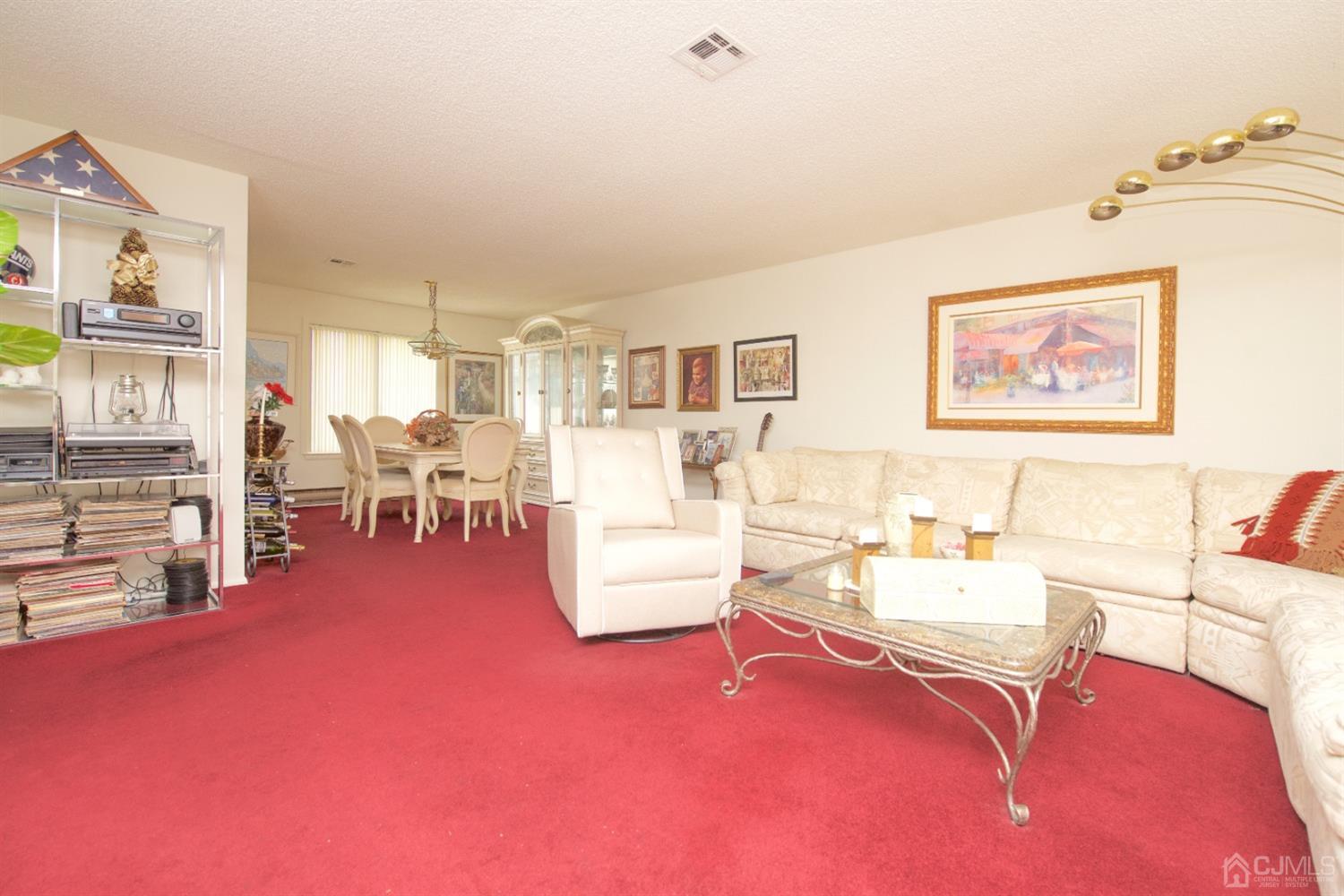 A Pompton Road Monroe Township, NJ 08831 - Photo 7 of 30 a living room with furniture and a table