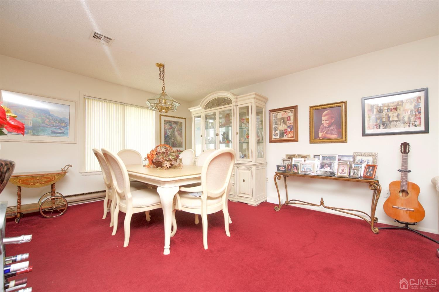 A Pompton Road Monroe Township, NJ 08831 - Photo 9 of 30 a dining room with furniture and a chandelier
