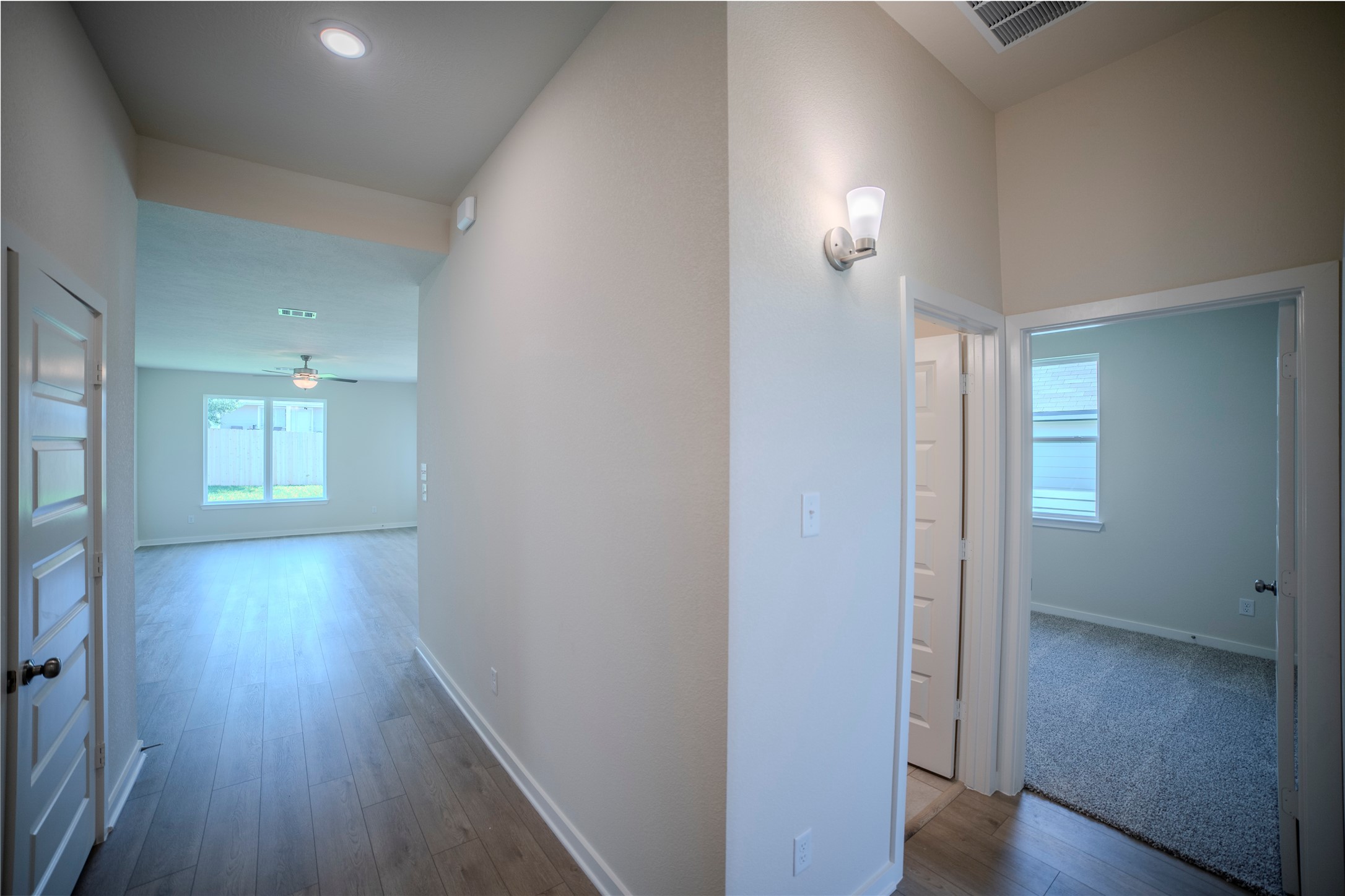 1402 Lk Rdg Drive Brenham, TX 77833 - Photo 7 of 35 wooden floor in an empty room with a window