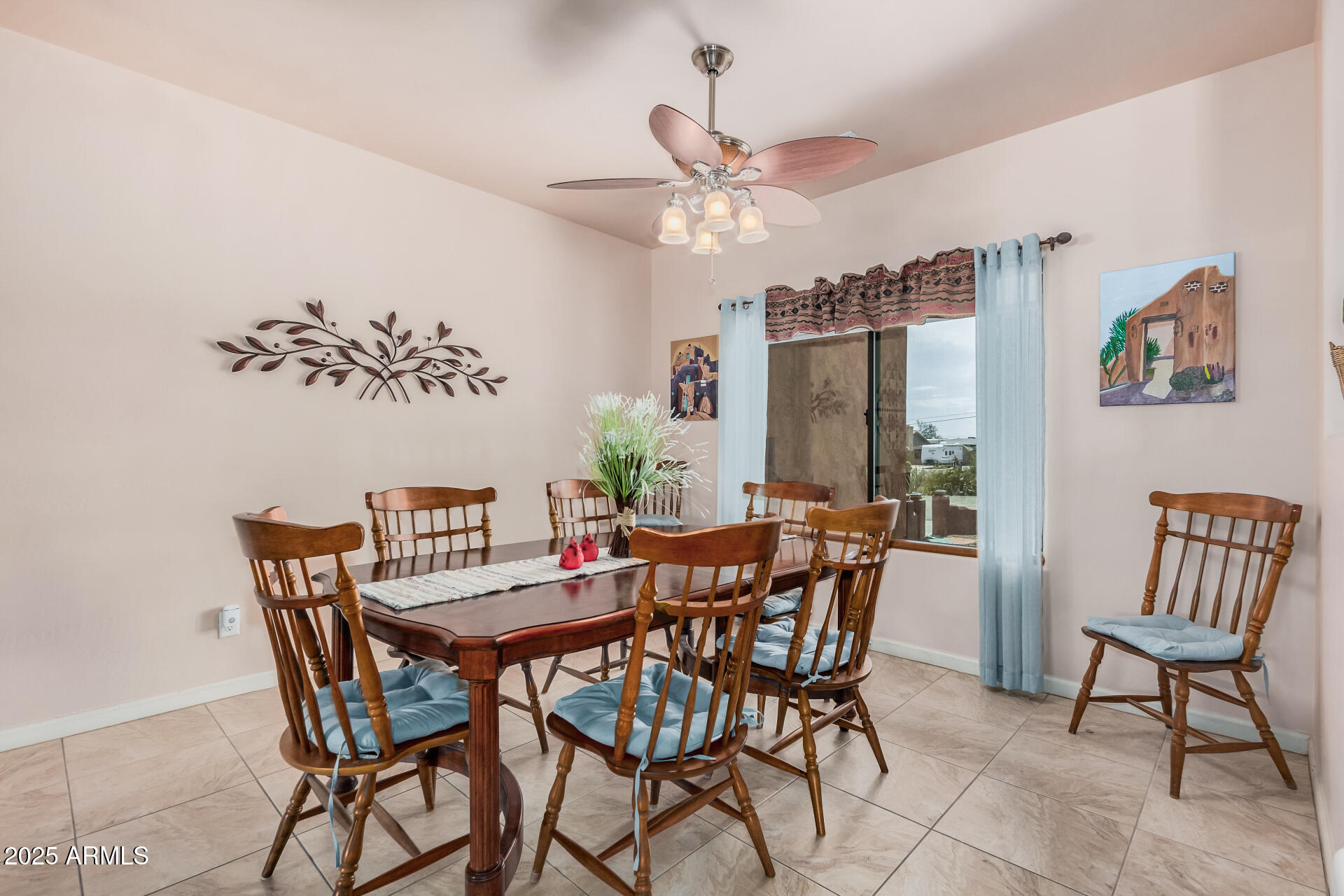 1025 North Boyd Road Apache Junction, AZ 85119 - Photo 12 of 60 a view of a dining room with furniture and a chandelier fan