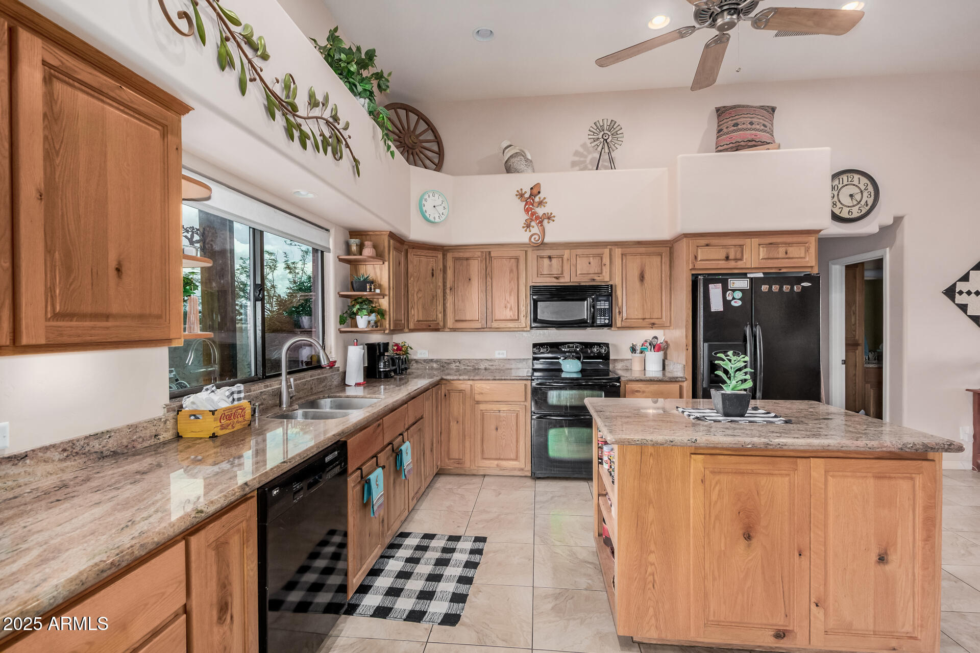 1025 North Boyd Road Apache Junction, AZ 85119 - Photo 15 of 60 a kitchen with stainless steel appliances granite countertop a sink stove and cabinets