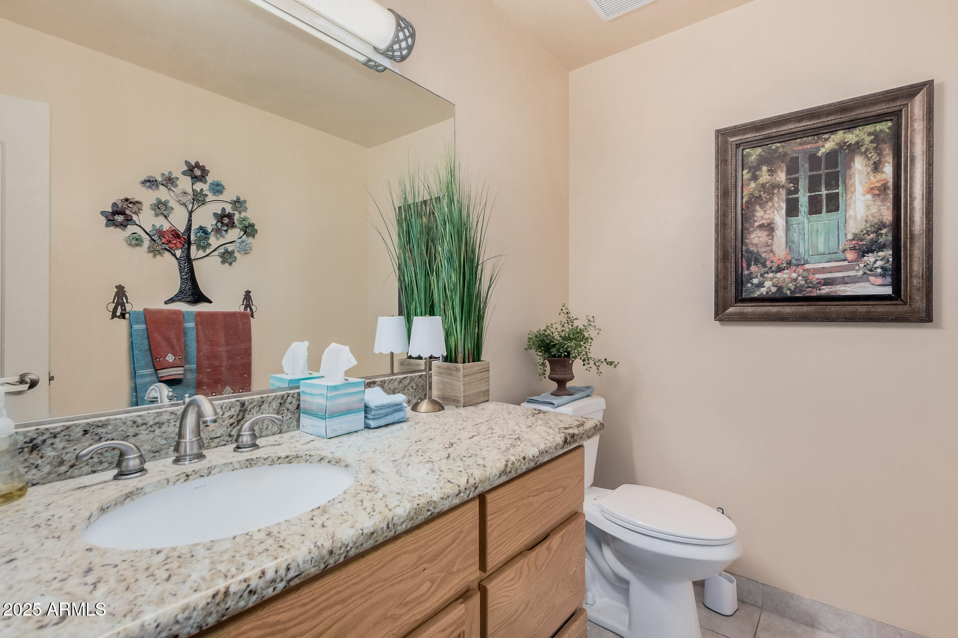 1025 North Boyd Road Apache Junction, AZ 85119 - Photo 18 of 60 a bathroom with a granite countertop sink and a mirror