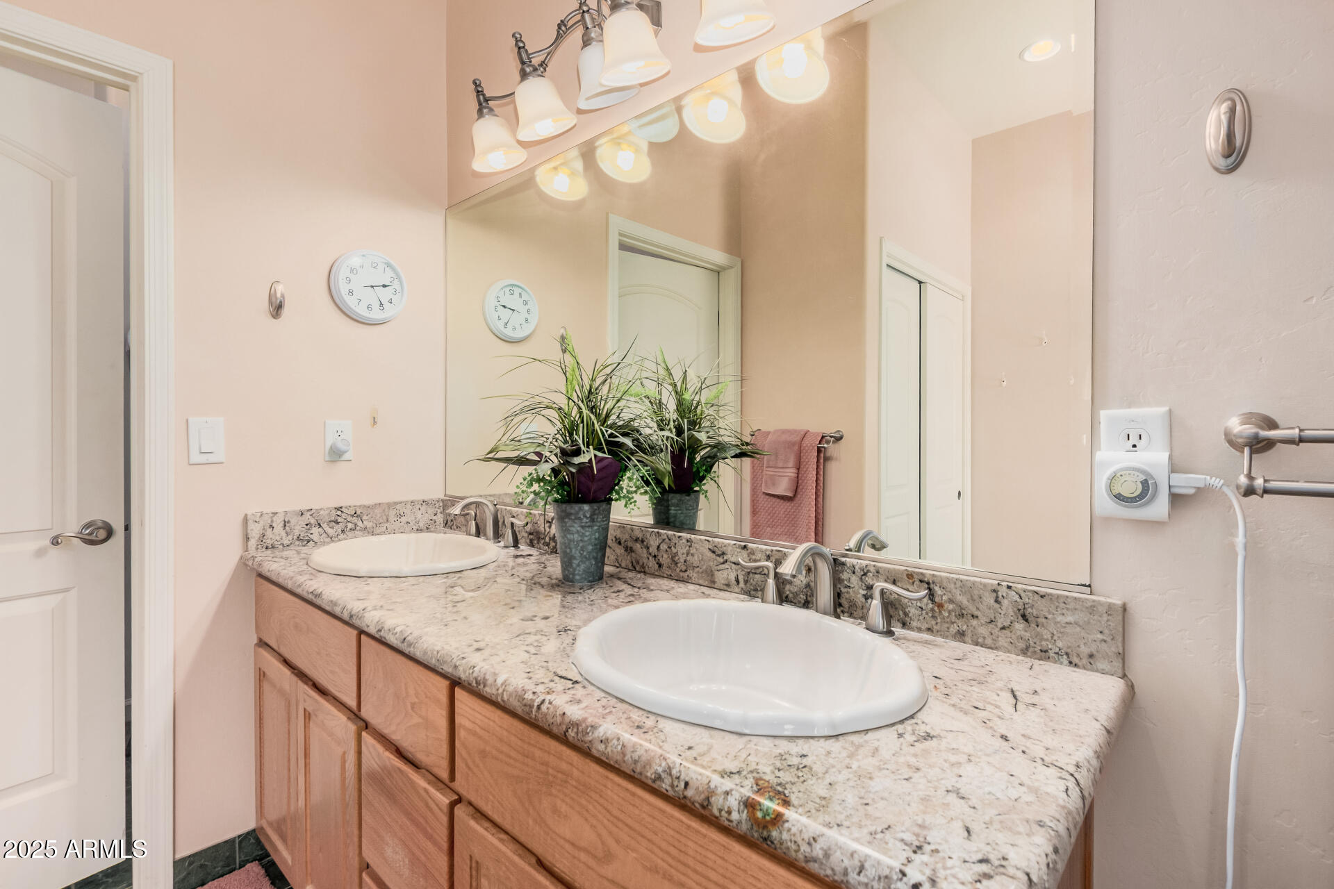 1025 North Boyd Road Apache Junction, AZ 85119 - Photo 22 of 60 a bathroom with a granite countertop sink a mirror and a shower