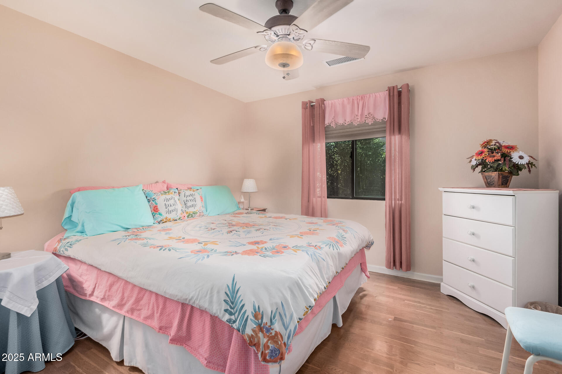 1025 North Boyd Road Apache Junction, AZ 85119 - Photo 29 of 60 a bedroom with a bed and a dresser