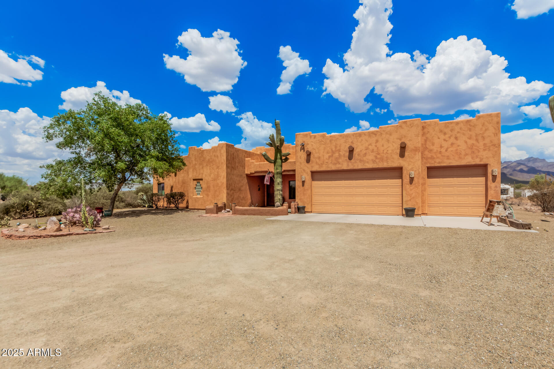 1025 North Boyd Road Apache Junction, AZ 85119 - Photo 3 of 60 a view of a house with a garage