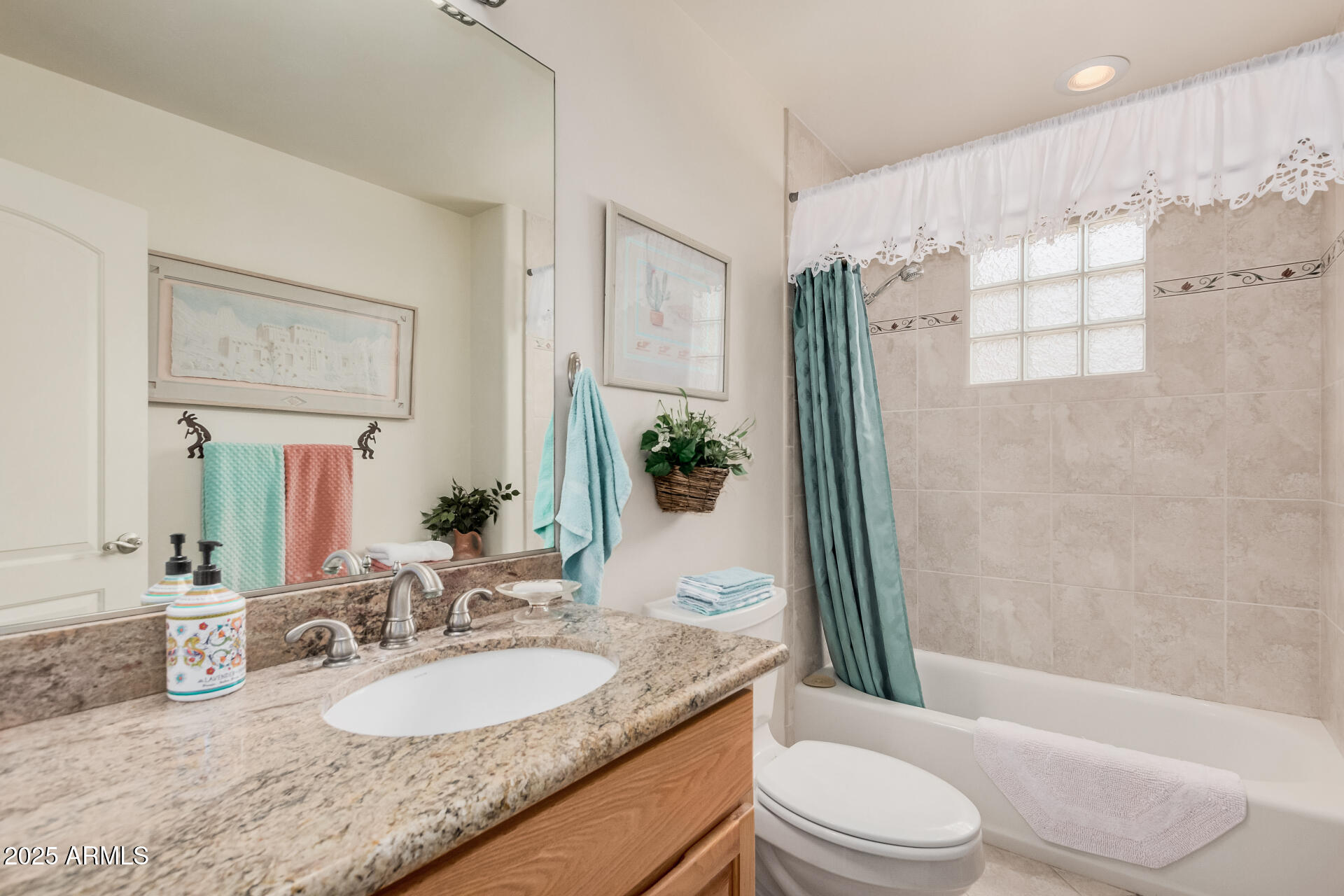 1025 North Boyd Road Apache Junction, AZ 85119 - Photo 32 of 60 a bathroom with a granite countertop sink toilet mirror and shower