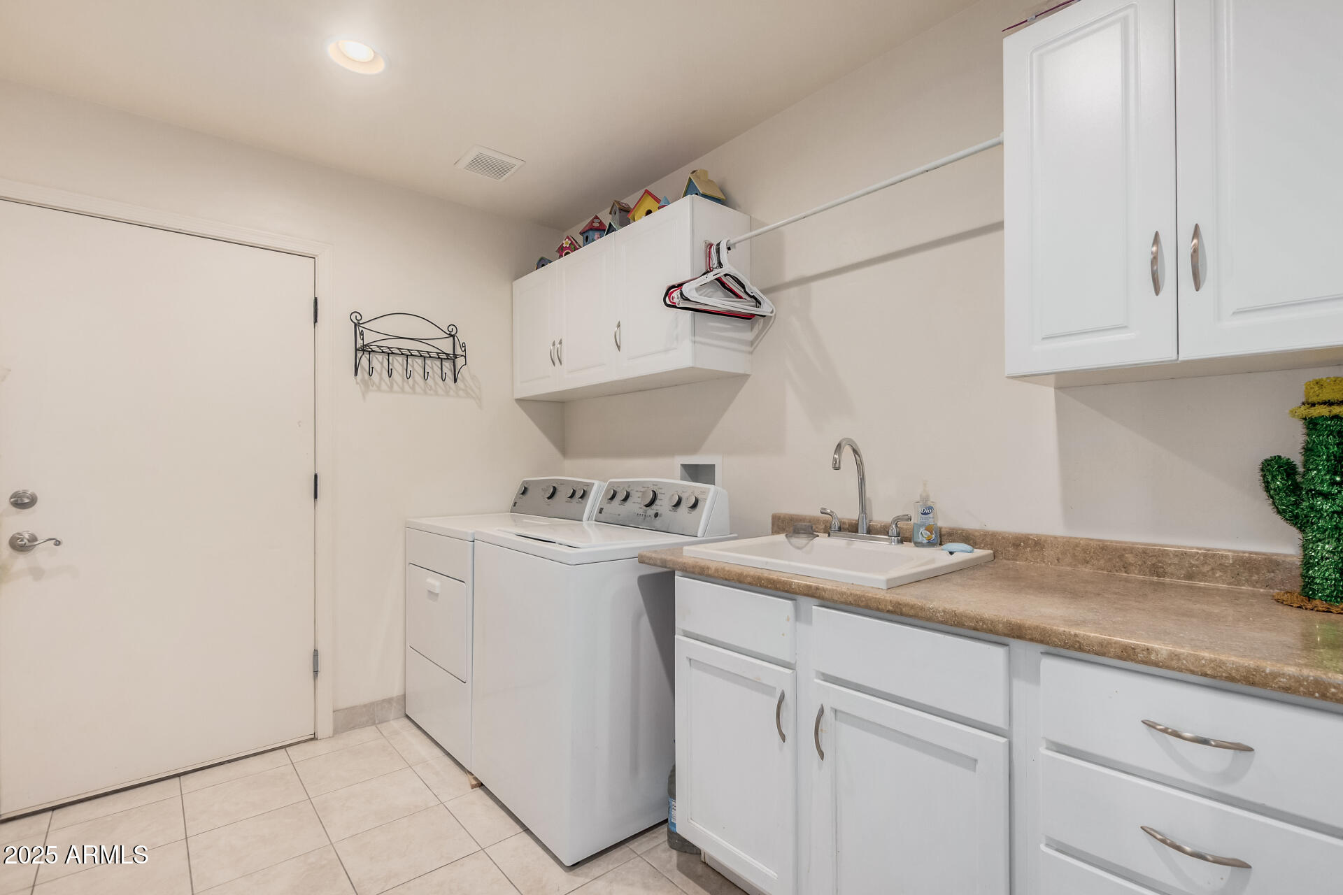 1025 North Boyd Road Apache Junction, AZ 85119 - Photo 33 of 60 a kitchen with a sink and cabinets