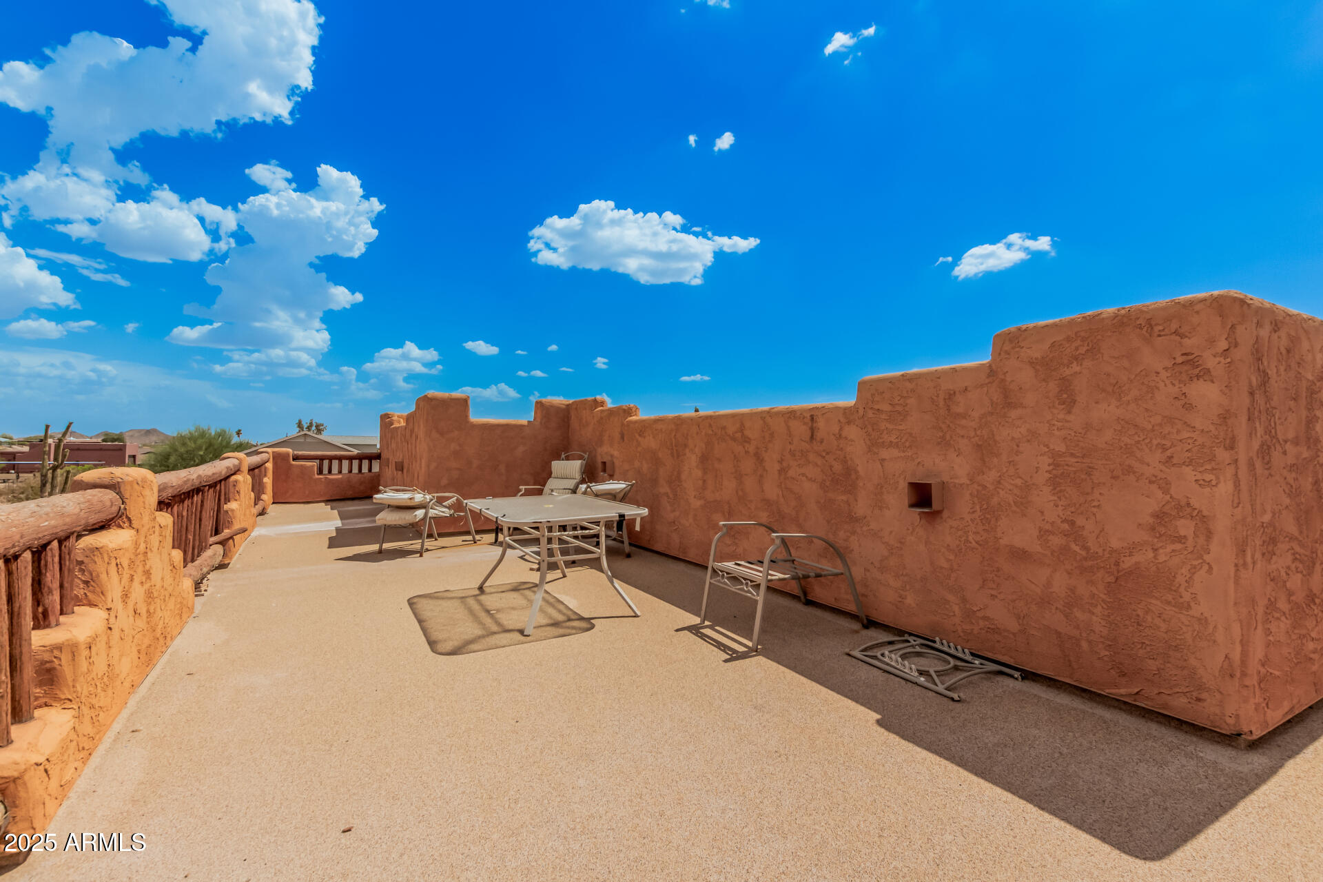1025 North Boyd Road Apache Junction, AZ 85119 - Photo 34 of 60 a view of a terrace with a table and chairs