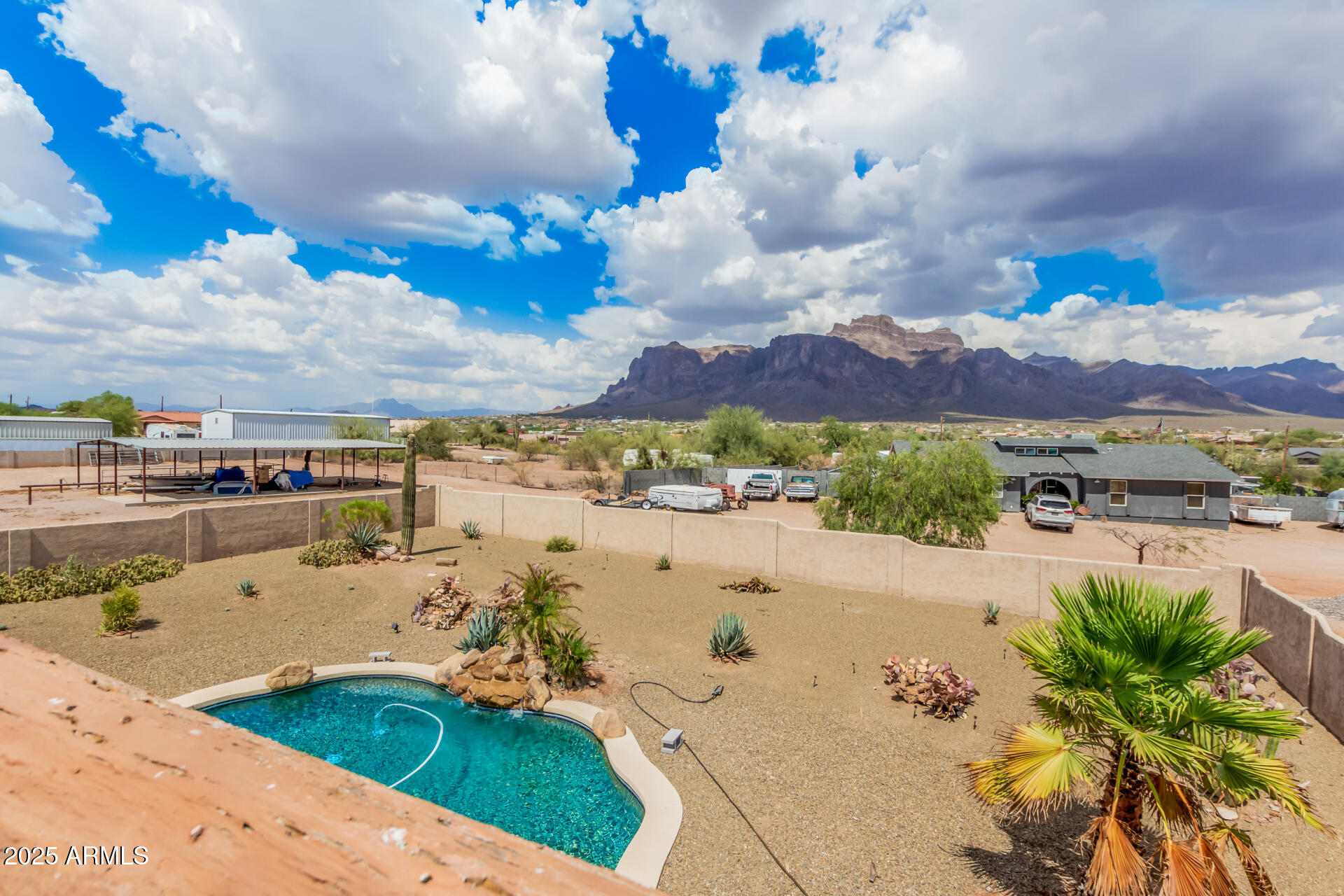 1025 North Boyd Road Apache Junction, AZ 85119 - Photo 43 of 60 a view of a lake with a building in the background