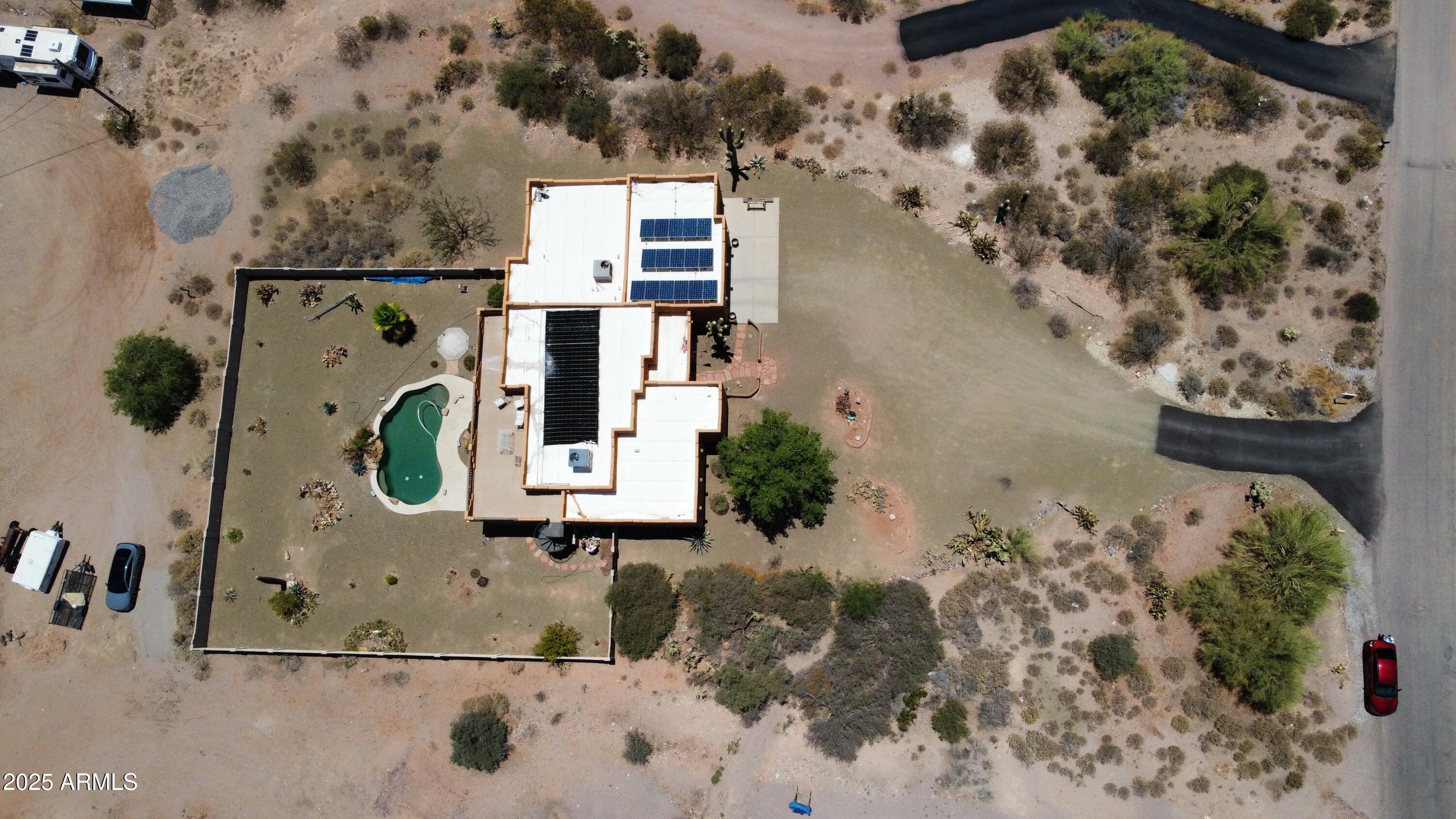 1025 North Boyd Road Apache Junction, AZ 85119 - Photo 49 of 60 an aerial view of a house with a yard