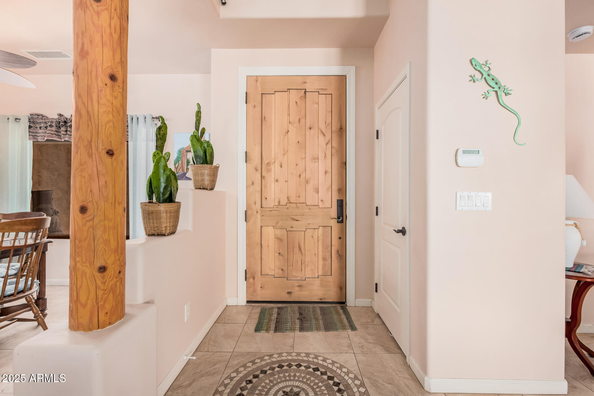 1025 North Boyd Road Apache Junction, AZ 85119 - Photo 8 of 60 a view of a hallway with wooden floor and a livingroom