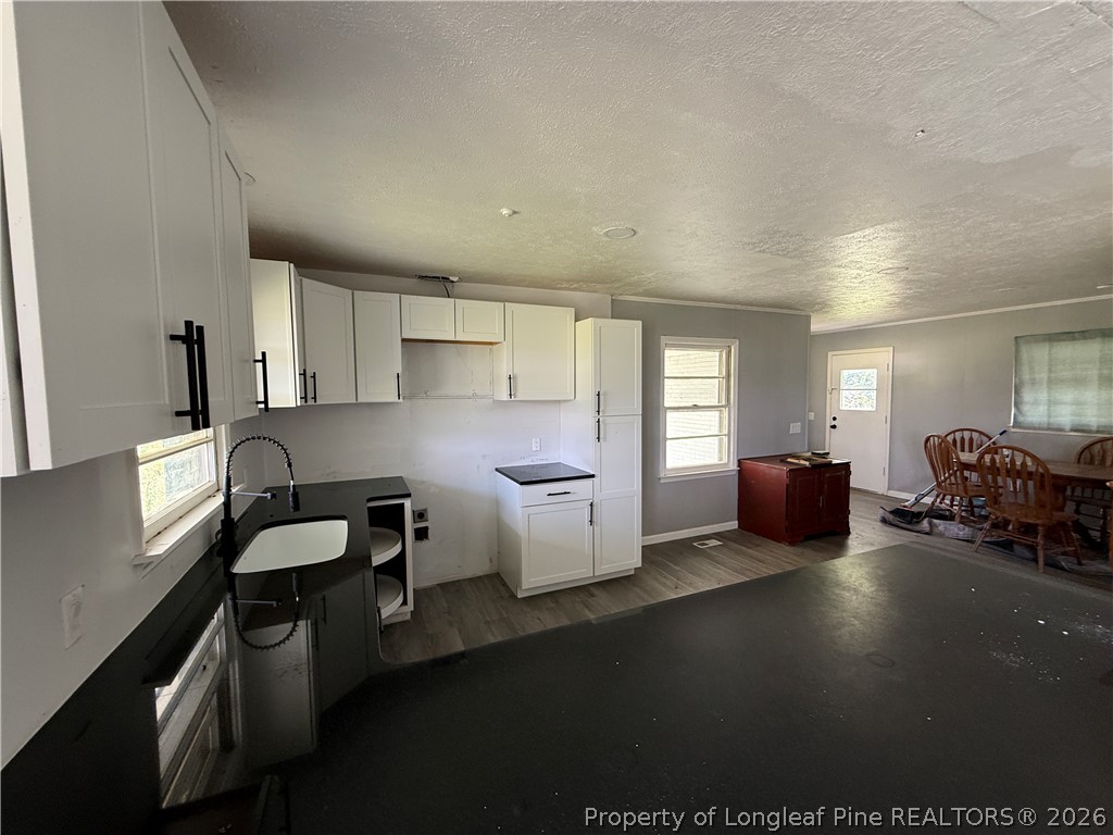 736 Tobermory Road Fayetteville, NC 28306 - Photo 5 of 17 a kitchen with furniture and window