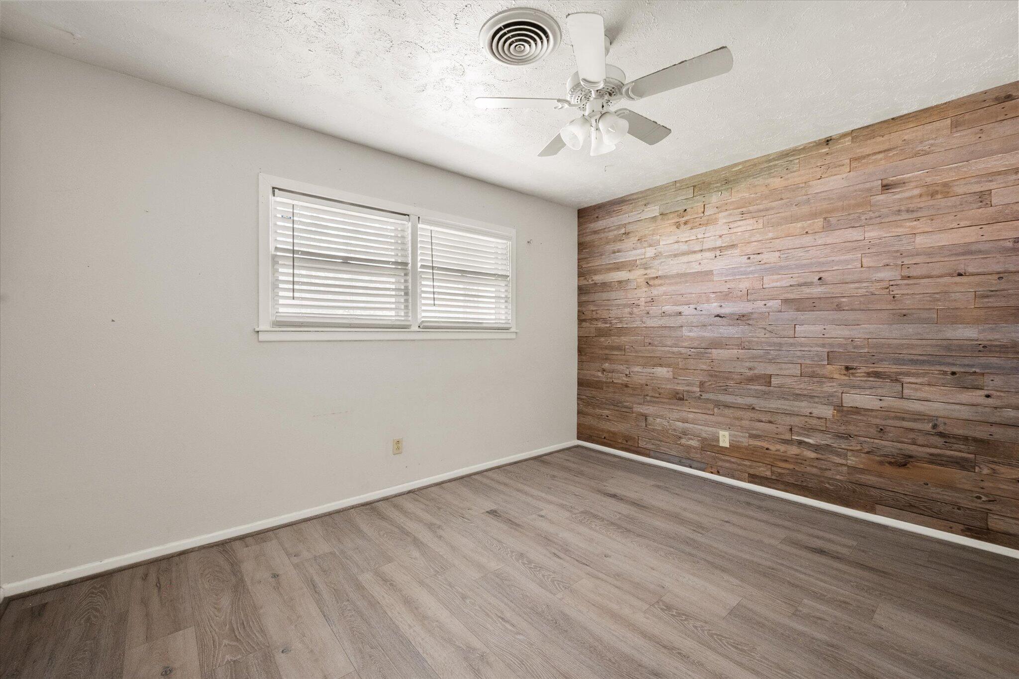 4604 27th Street Lubbock, TX 79410 - Photo 11 of 36 an empty room with a window