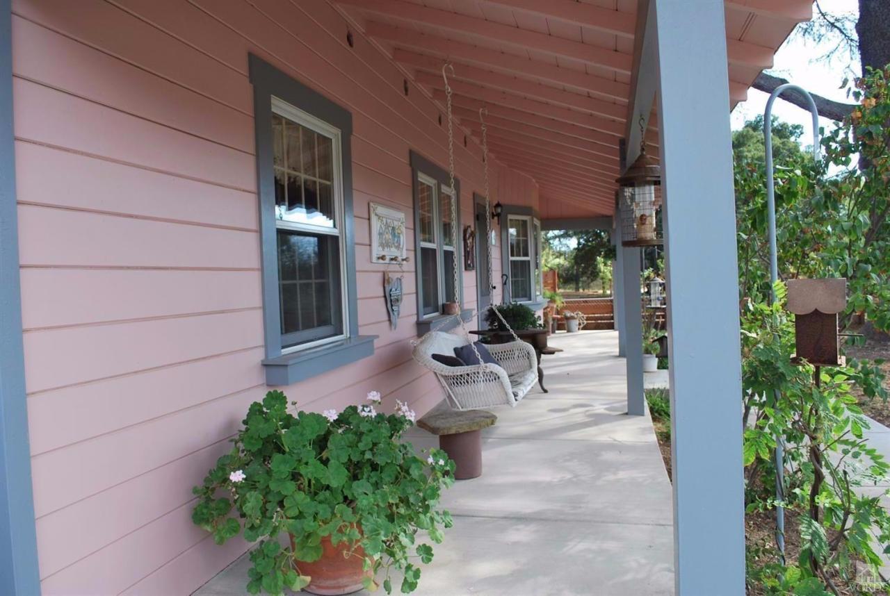 486 South Rice Road Ojai, CA 93023 - Photo 2 of 48 a view of a patio with table and chairs and potted plants