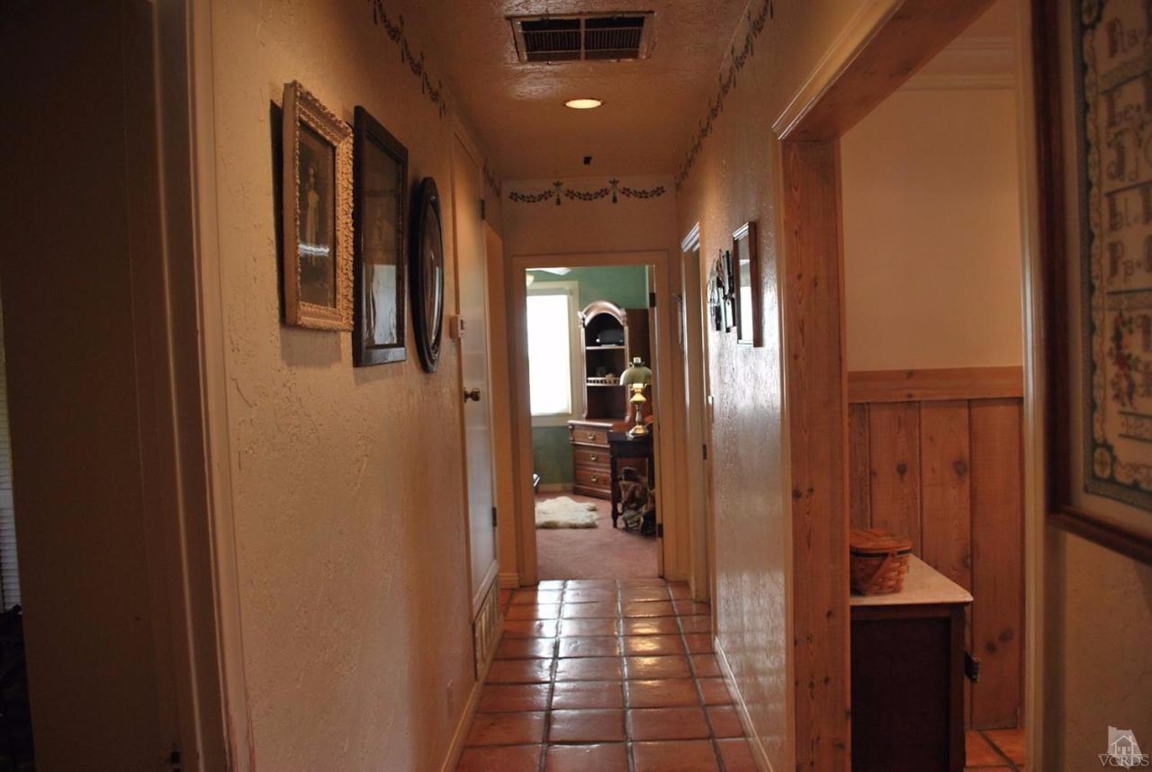 486 South Rice Road Ojai, CA 93023 - Photo 20 of 48 a view of a hallway with a furniture and front door