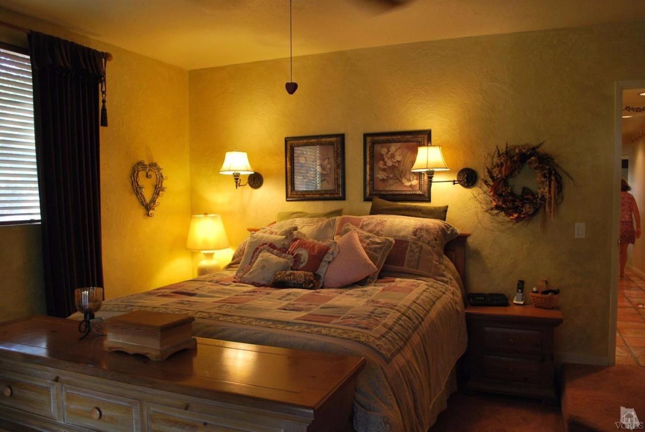 486 South Rice Road Ojai, CA 93023 - Photo 21 of 48 a bedroom with a bed and wooden floor