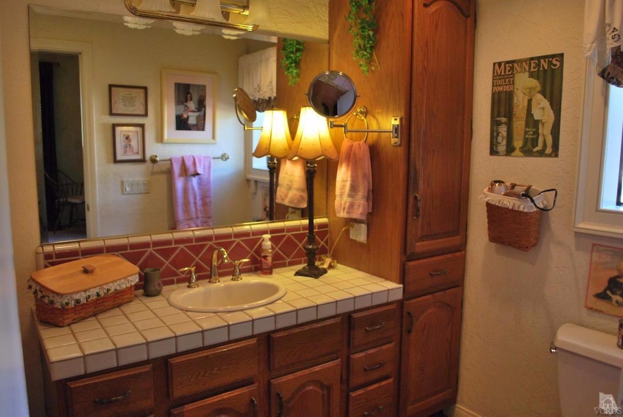 486 South Rice Road Ojai, CA 93023 - Photo 23 of 48 a bathroom with a sink and a mirror