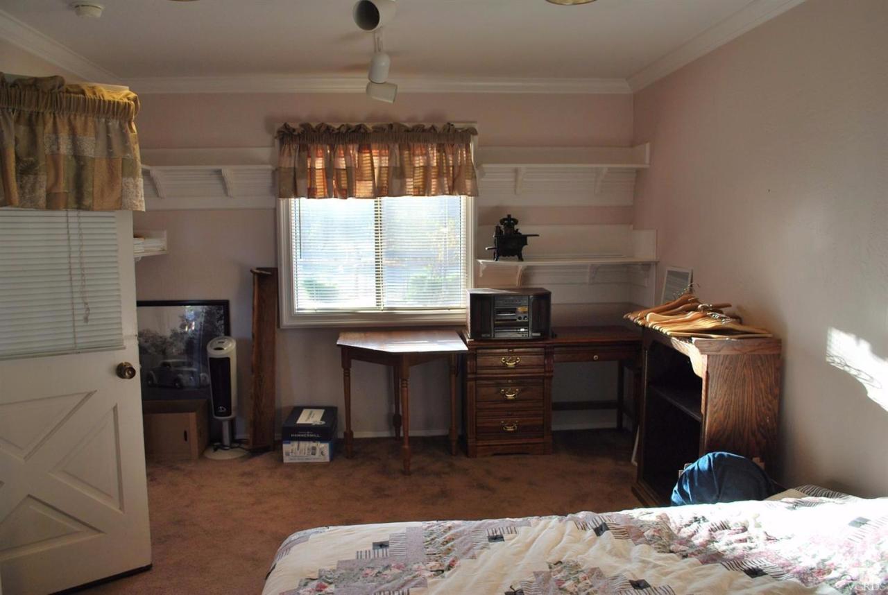 486 South Rice Road Ojai, CA 93023 - Photo 27 of 48 a room with a bed and a chandelier