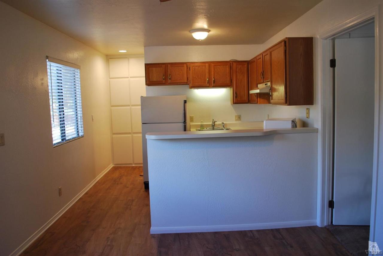 486 South Rice Road Ojai, CA 93023 - Photo 40 of 48 a kitchen with kitchen island a sink stainless steel appliances and cabinets