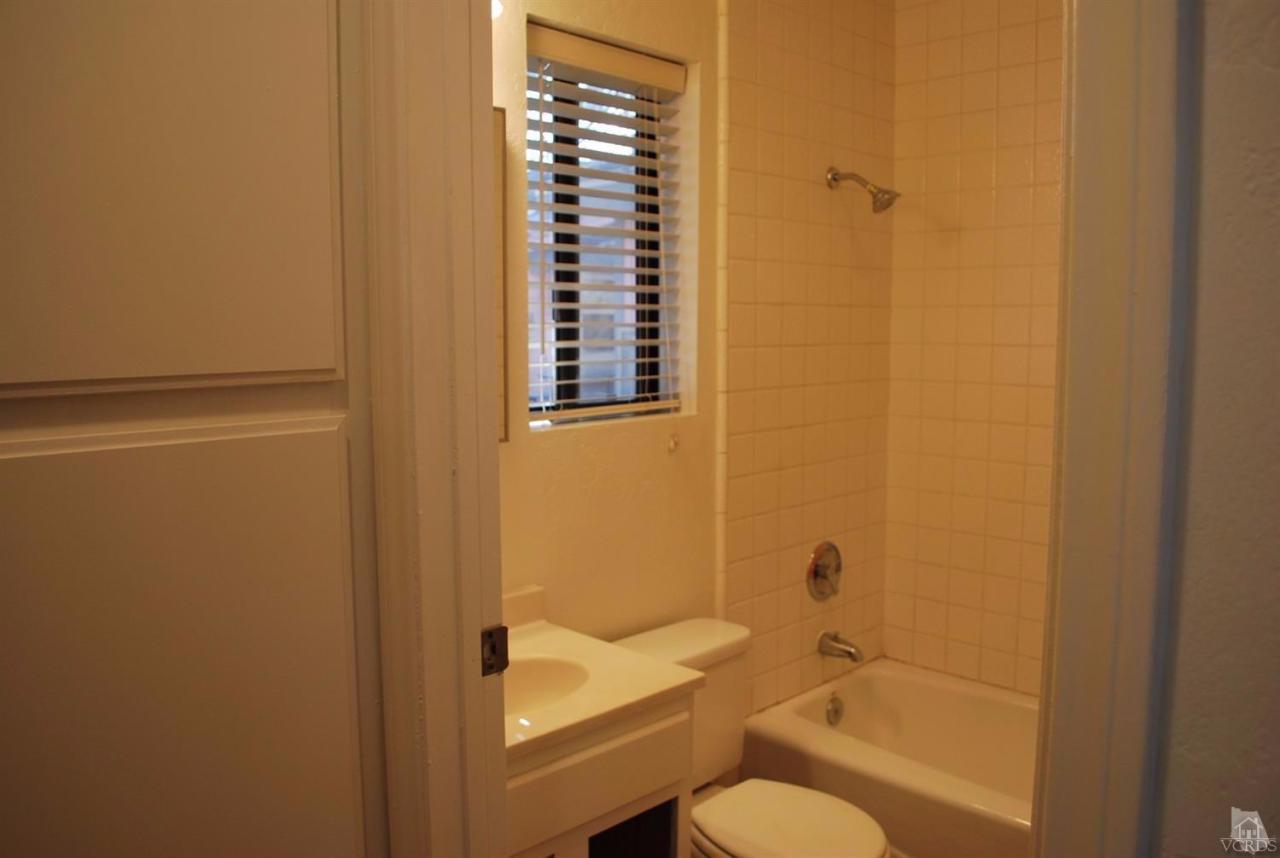 486 South Rice Road Ojai, CA 93023 - Photo 42 of 48 a bathroom with a granite countertop toilet a sink and bathtub