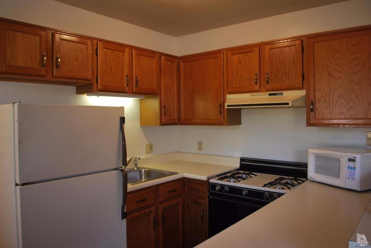 486 South Rice Road Ojai, CA 93023 - Photo 44 of 48 a kitchen with stainless steel appliances a refrigerator a sink a stove and cabinets