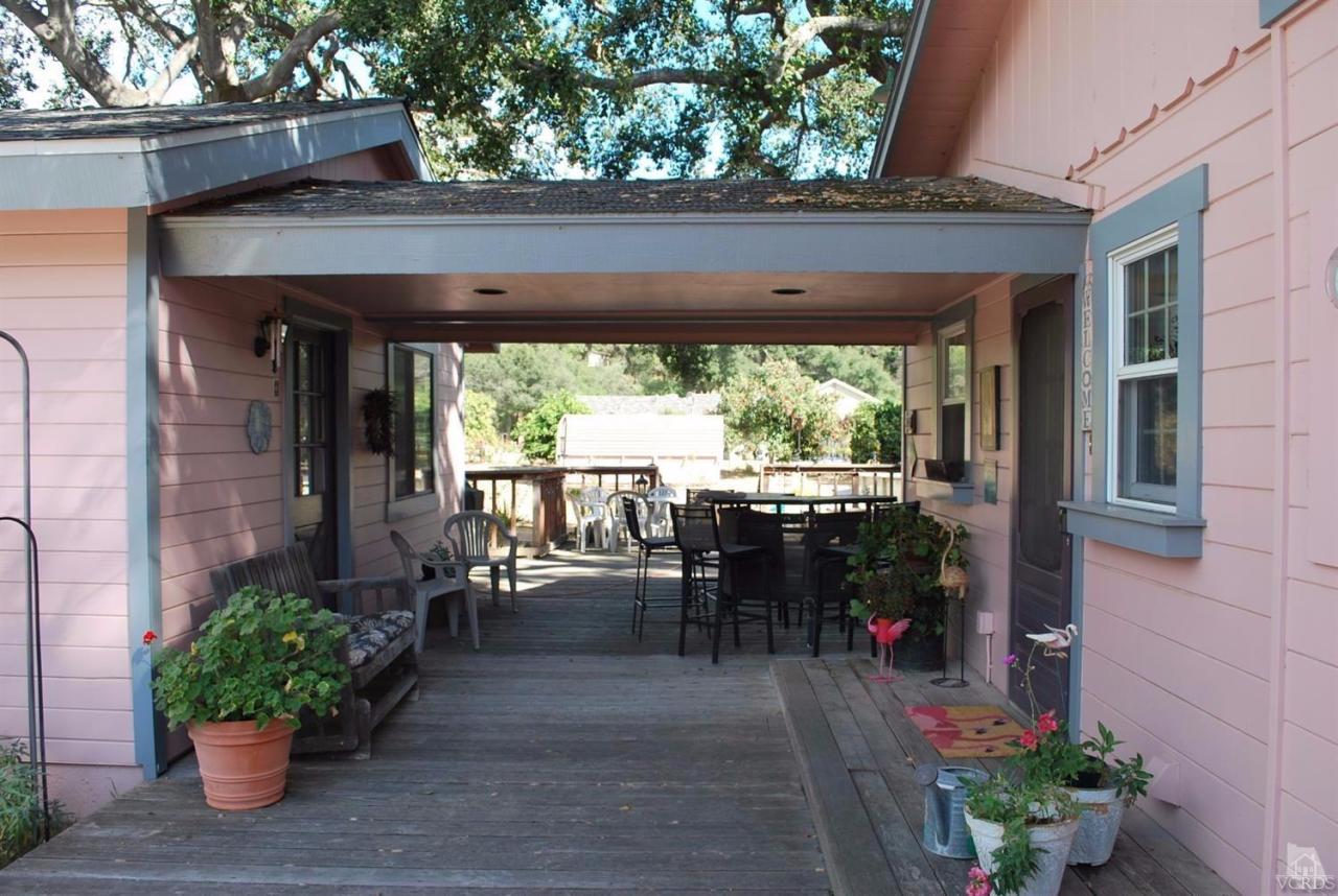 486 South Rice Road Ojai, CA 93023 - Photo 6 of 48 a view of a patio with a table and chairs potted plants