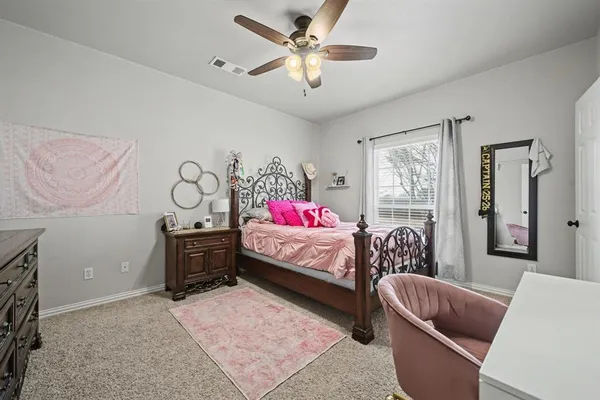 a bedroom with furniture and a window