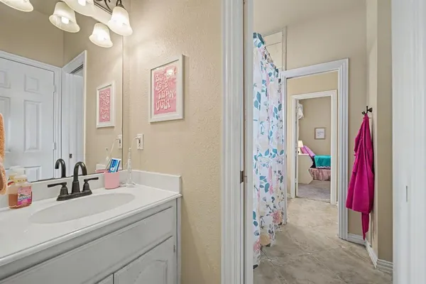 a bathroom with a sink a vanity and a mirror