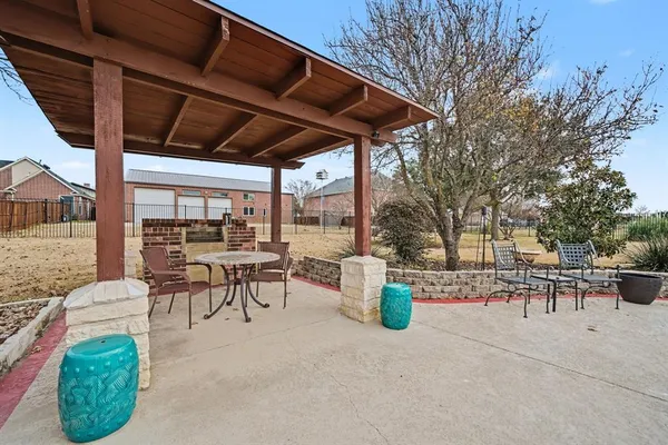 an outdoor space with swimming pool and furniture
