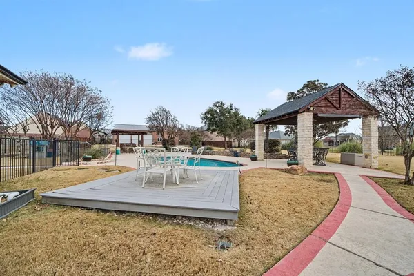 a view of yard with patio